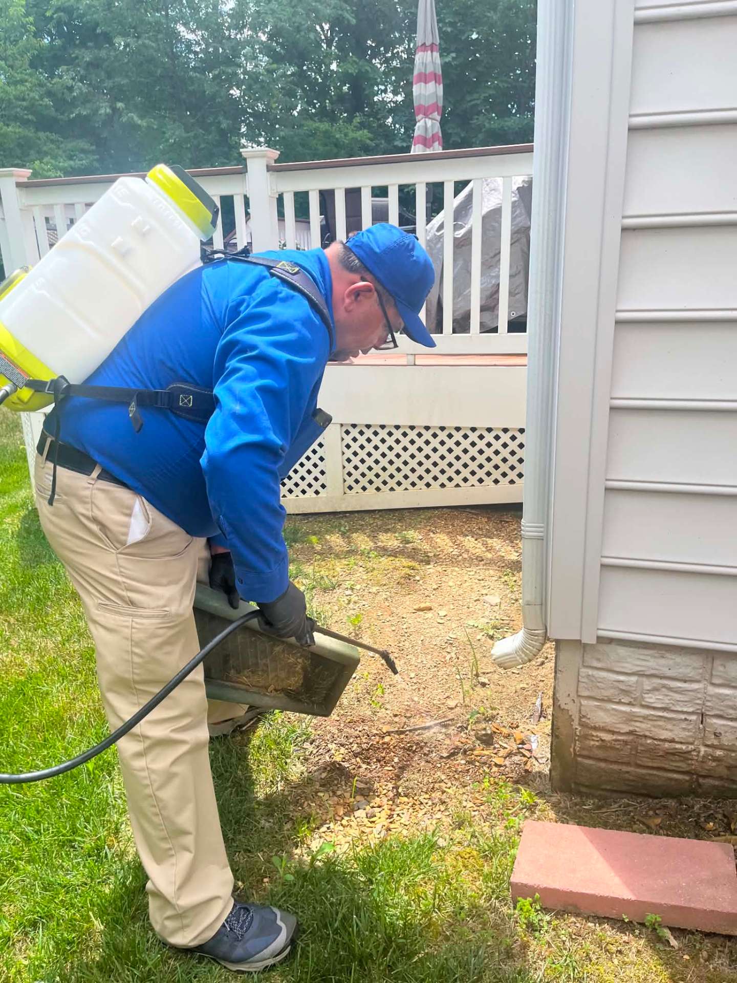Residential foundation pest control treatment by Preferred Pest Pros LLC technician