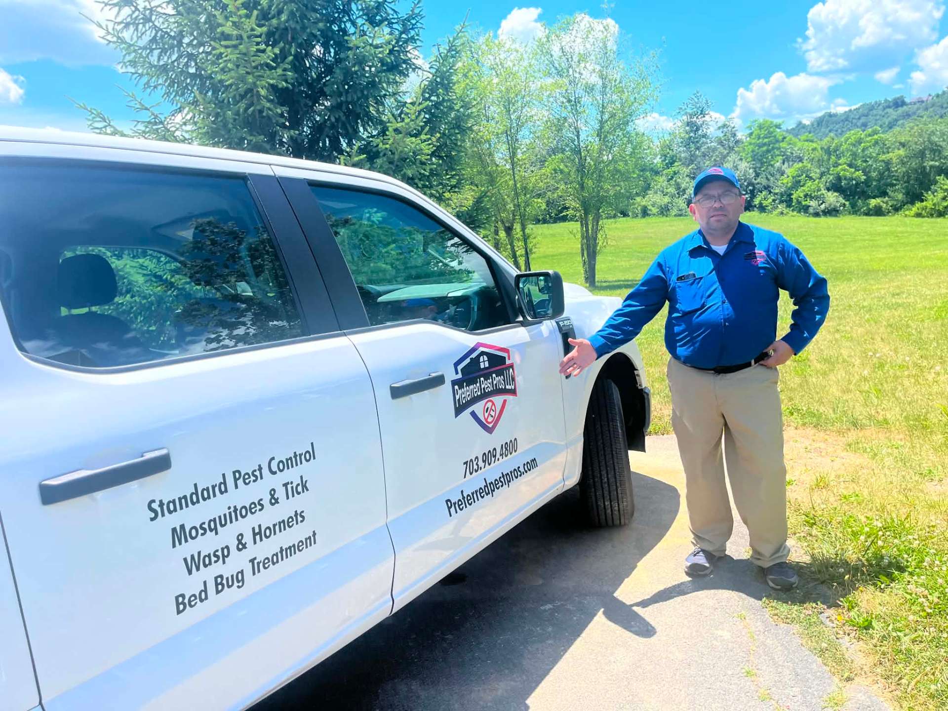 Preferred Pest Pros owner beside company vehicle showing Standard Pest Control, Mosquito, Wasp and Bed Bug services
