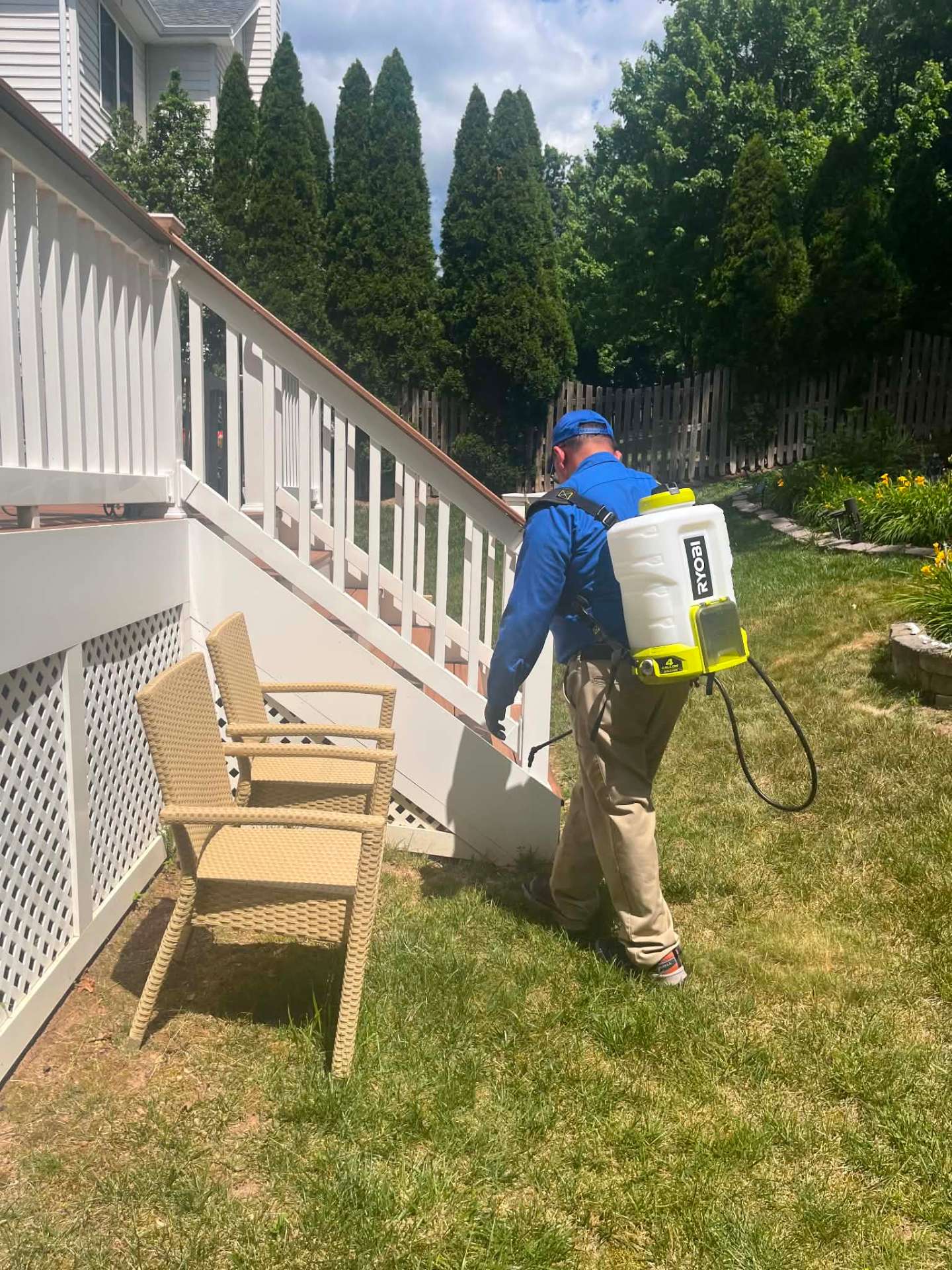 Preferred Pest Pros technician performing exterior perimeter pest control treatment in Northern Virginia
